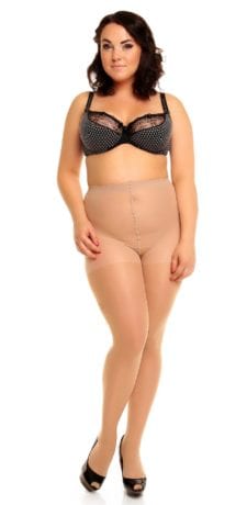 Plus size model wearing Glamory vital 70 support tights in color teint front view